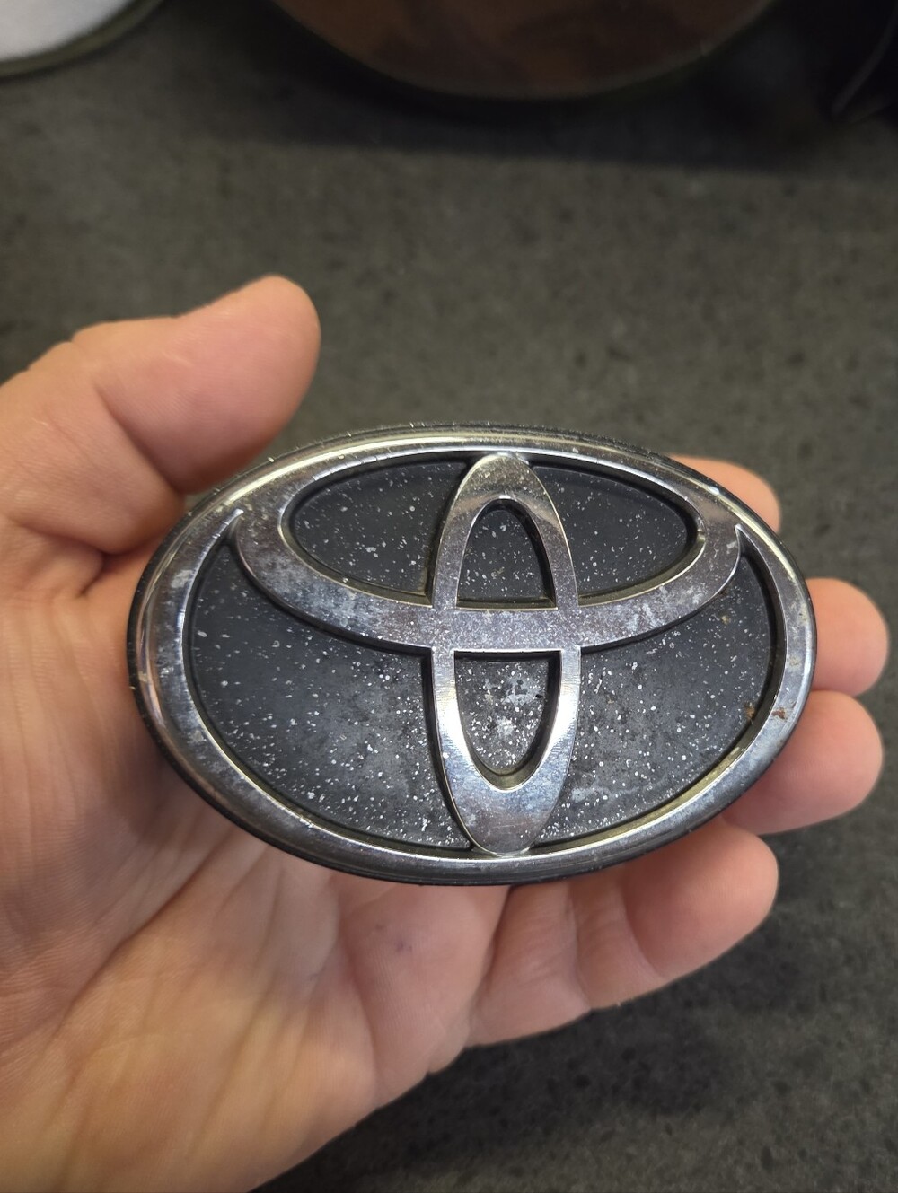 Black & Silver Oval Emblem Badge - Fits 1998 - 1999 Toyota Tercel CE.